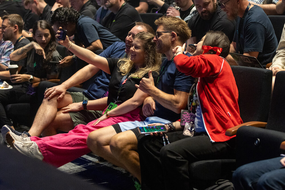 Laracon AU attendees taking a selfie in the audience