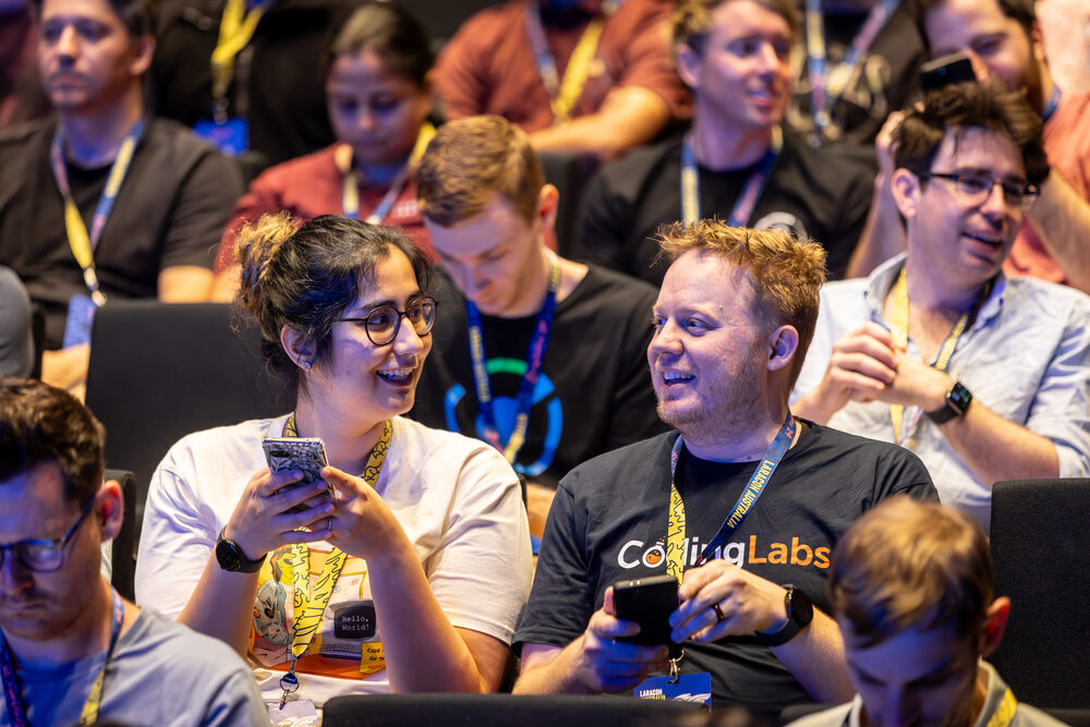 Attendees seated at a conference session